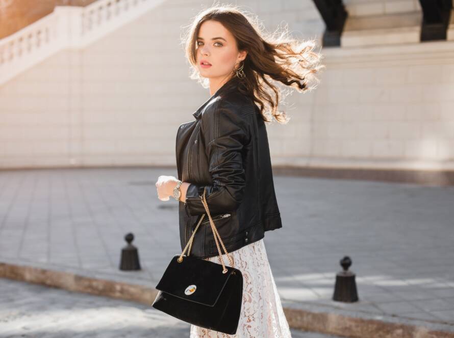 attractive woman walking in street in fashionable outfit